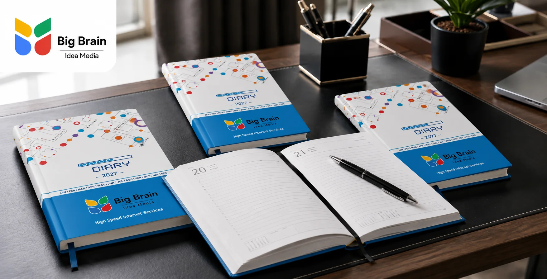 Premium Big Brain Idea Media business diary with custom blue cover design, logo, pen, and modern office setup.
